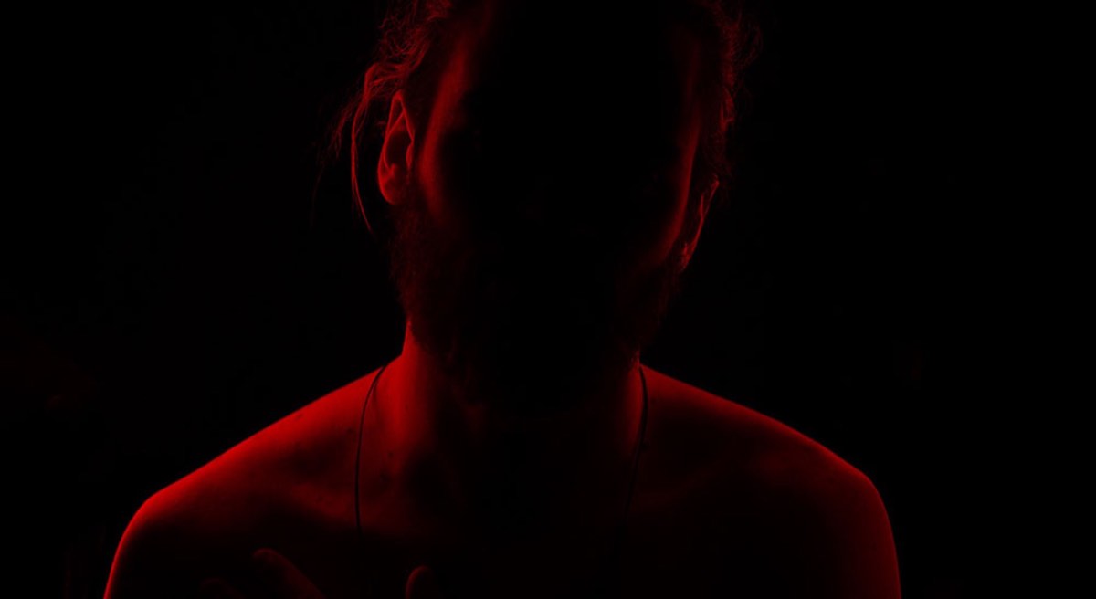 Man in red shadow