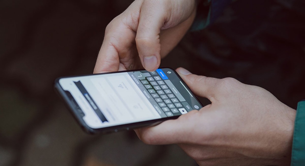 hand of person using smartphone
