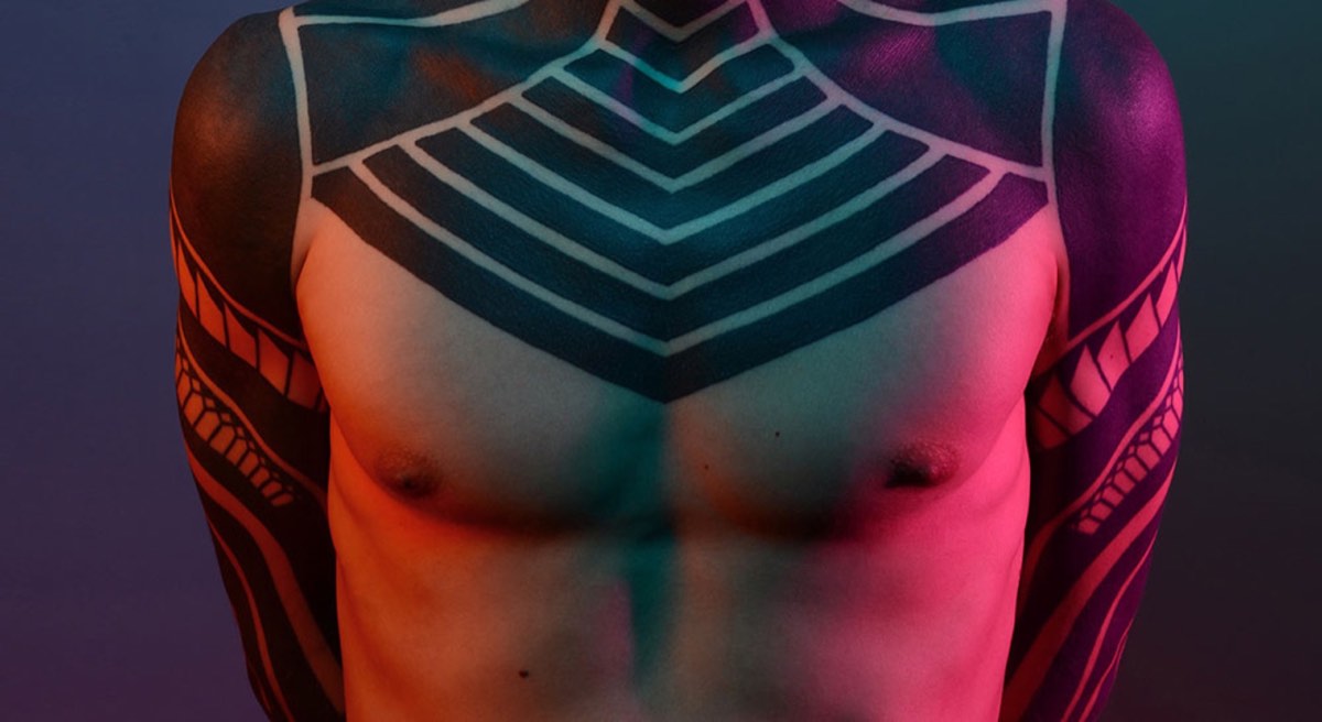 shirtless man with tattoo