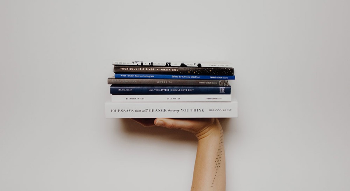 Hand holding books