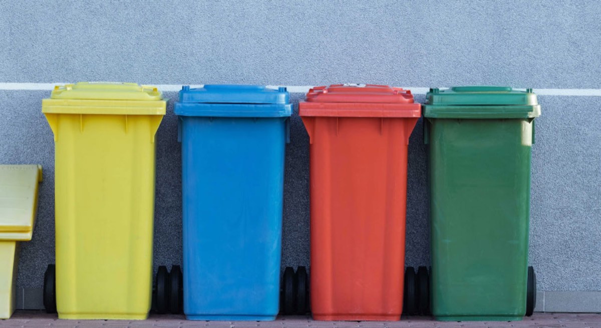 four assorted color trash bin